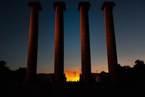 magic fountain four beige concrete pillars barcelona
